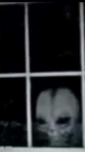 Old School Video Alien Grey Peaking Through Window