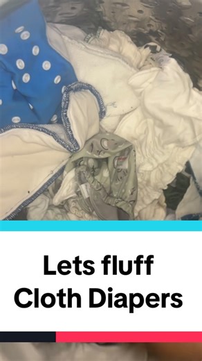 Mr. & Mrs. Armstrong 💪🏾 on Instagram: "Fluffing cloth diapers means loosening them up after a wash cycle to ensure proper agitation, cleaning, and rinsing. This is done by separating nested, stuck-together diapers before the main wash and before drying, often done by shaking them out or adding small agitator items to the machine to prevent them from becoming a single, dense, wet clump. #fluff #clothdiaper #washday #prewash #clothdiapertiktok"