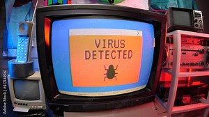 Retro computer with a virus detected message appearing on the screen.90s Retro style concept.