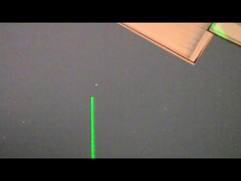 Man Points At UFO With Laser Beam