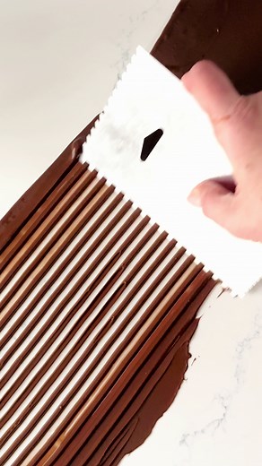 Chocolate decor tutorial! I’ve been making tempered chocolate loops and twists using this method for the last 5 years and I have to say it’s one of my favourite ways to make tempered chocolate decor for a dessert. Save this video for some tips: ☑️ Cut a strip of acetate and lay it on your workspace. You can help the acetate stick by applying a very thin coat of oil to your workspace (I use a paper towel) ☑️ Thinly spread tempered chocolate on your acetate using an offset spatula ☑️ Using a fine