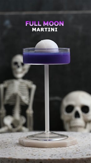 Full Moon Martini – what a great cocktail! 🌕✨ It looks out of this world 🚀, which is why I picked purple glitter. Honestly, it looks like an alien cocktail 👽, and it tastes just like a Blue Hawaiian—one of my favorite cocktails! 🍹💙 If you make it, drop a comment and let me know how it tastes. 👇🗣️” Recipe: \t•\t🥃 2 oz white rum \t•\t🔵 1 oz blue curaçao \t•\t🥥 1 oz cream of coconut \t•\t🍍 2 oz pineapple juice For the Ice Sphere: \t•\t🥥 1 part cream of coconut \t•\t💧 3 parts water #Spo